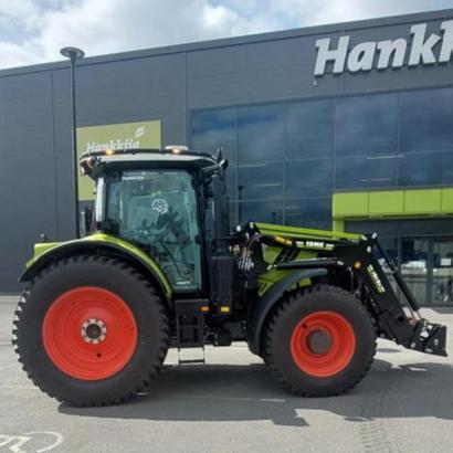 CLAAS ARION 660 CEBIS CMATIC -traktori etukuormaajalla