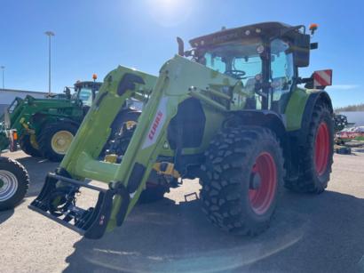 CLAAS ARION 550 Cebis Cmatic -traktori etukuormaajalla